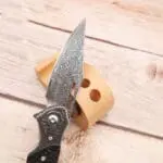 TOSAHWI Handmade Damascus Steel Folding Knife with Textured Purple Ebony Handle - Image 5