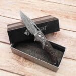 TOSAHWI Handmade Damascus Steel Folding Knife with Textured Purple Ebony Handle - Image 10